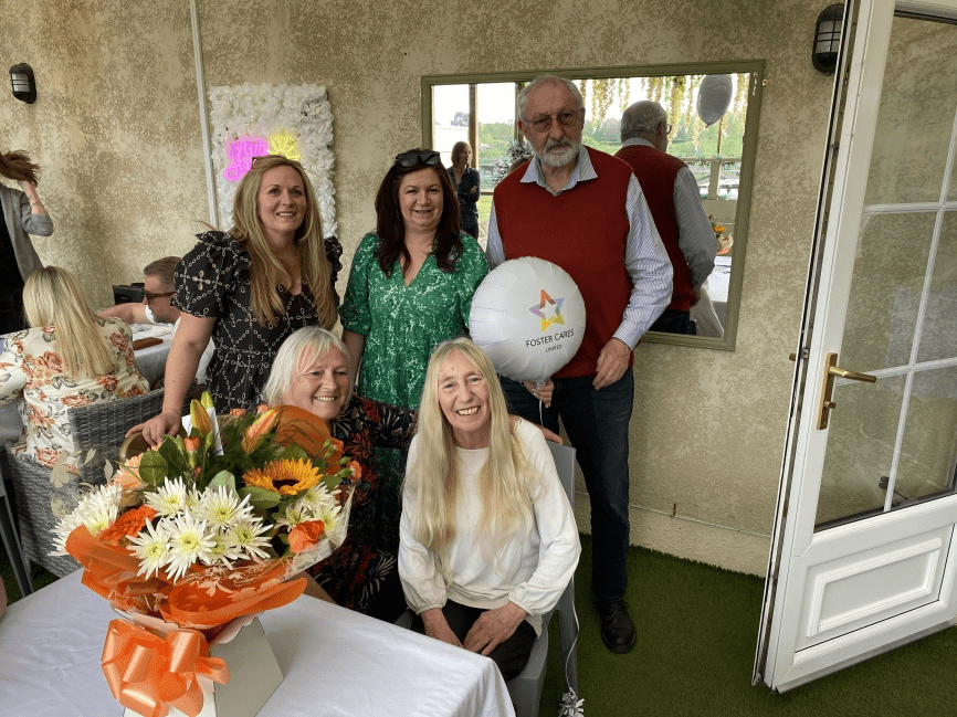 Anne Sherry, Foster carer receiving flowers for retirement   