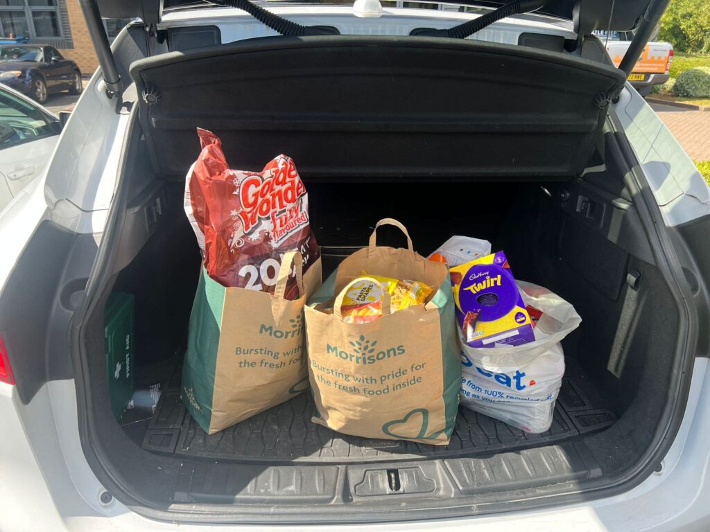 Food bank donation in the boot of a car